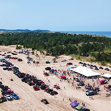 Tent-Table-Chairs-Bounce-House-Rentals-for-Heroes-on-the-Dunes-2024 1